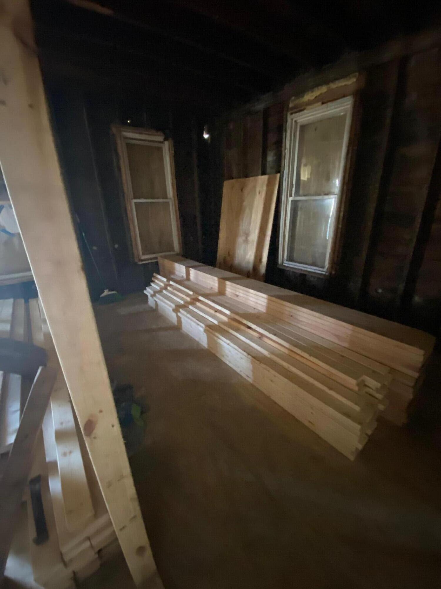 207 Chicago Street Michigan City, IN 46360 - Photo 12 of 14 a view of water heater room with wooden floor