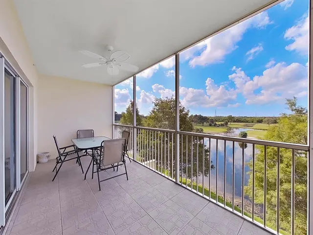 a view of a chairs and table in patio