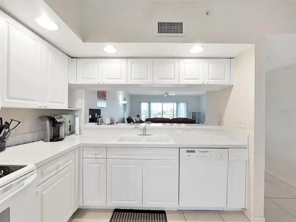 a kitchen with cabinets and appliances
