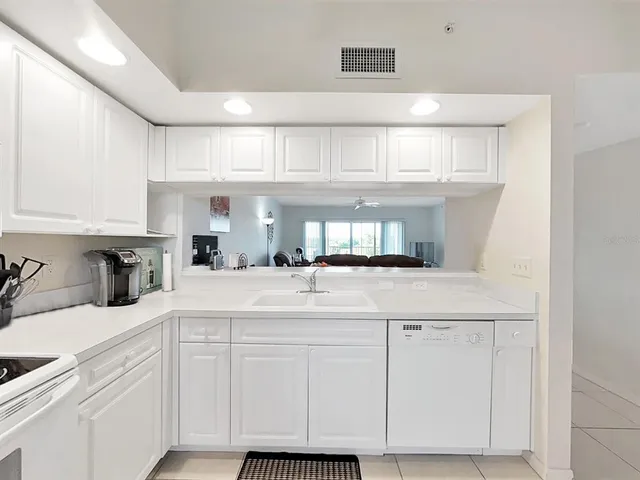 a kitchen with cabinets and appliances