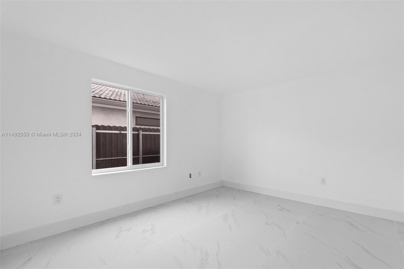 15951 Southwest 42nd Terrace Miami, FL 33185 - Photo 12 of 40 an empty room with a window