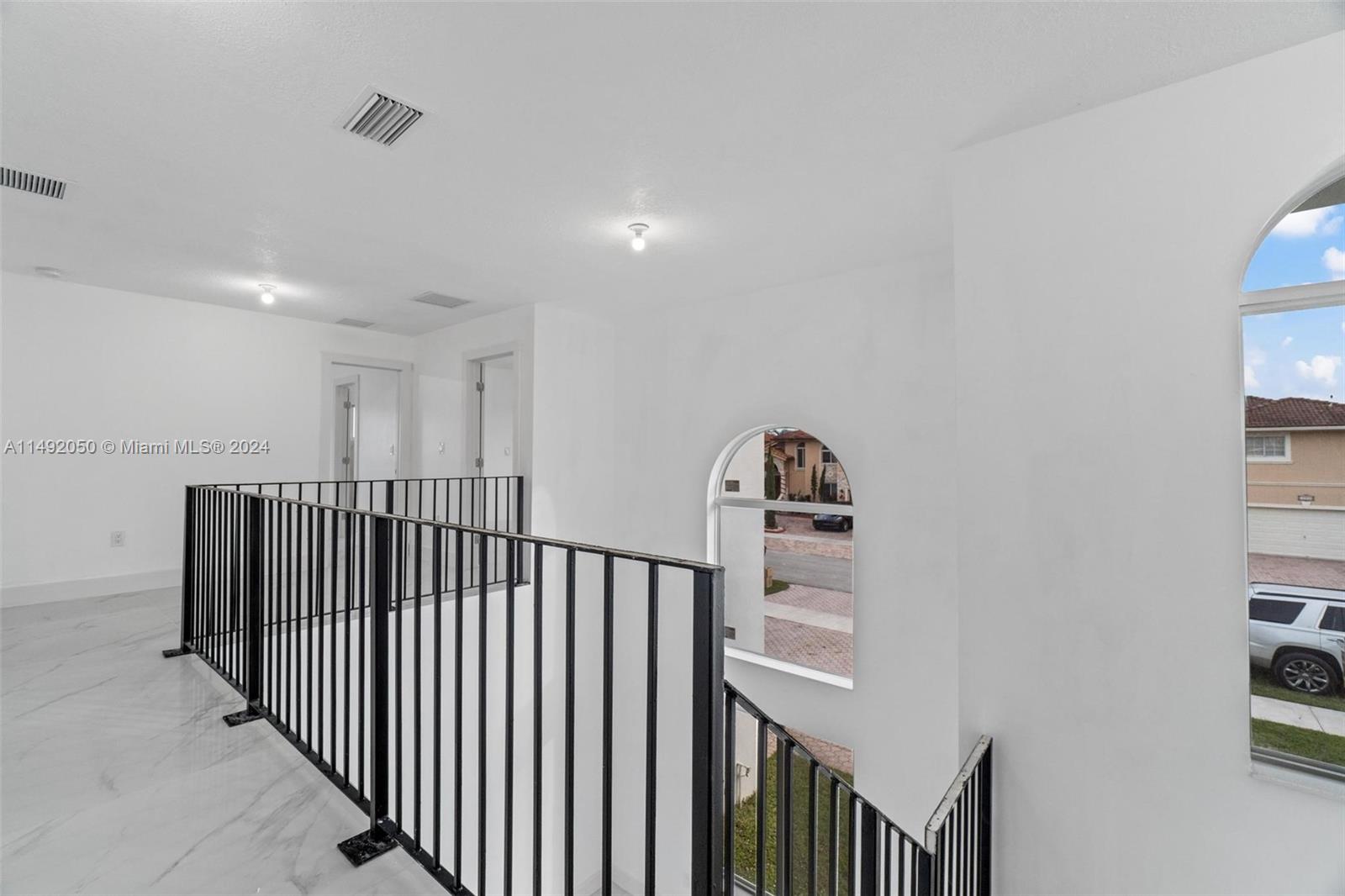 15951 Southwest 42nd Terrace Miami, FL 33185 - Photo 16 of 40 a view of a hallway with workspace