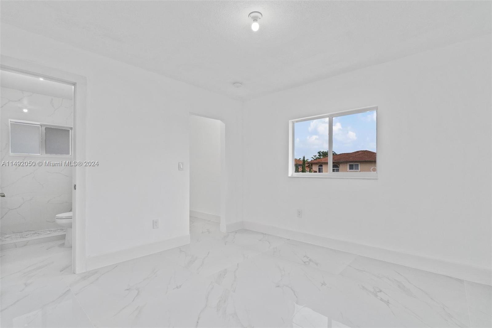 15951 Southwest 42nd Terrace Miami, FL 33185 - Photo 18 of 40 an empty room with a bathroom