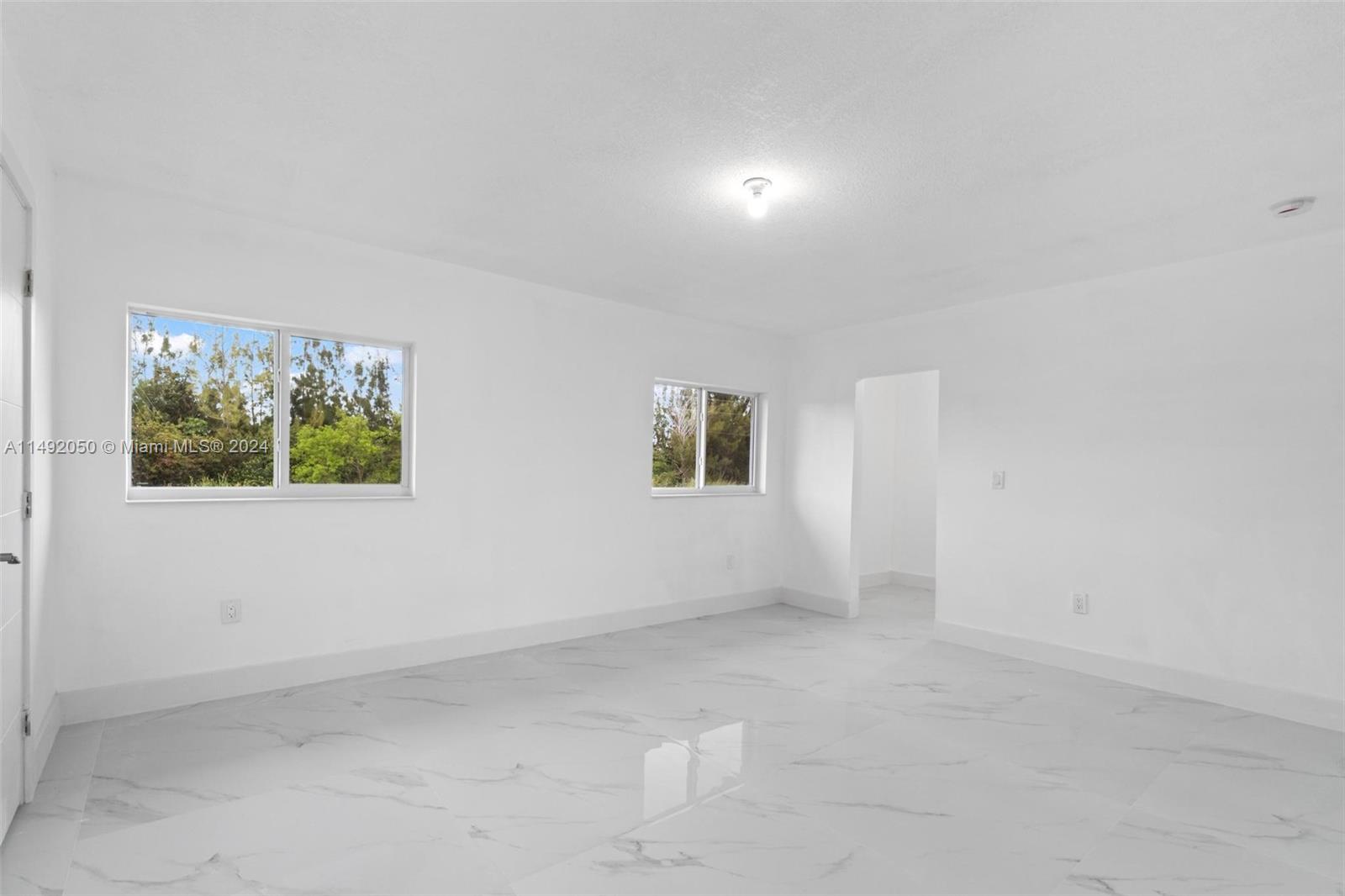 15951 Southwest 42nd Terrace Miami, FL 33185 - Photo 25 of 40 an empty room with a window