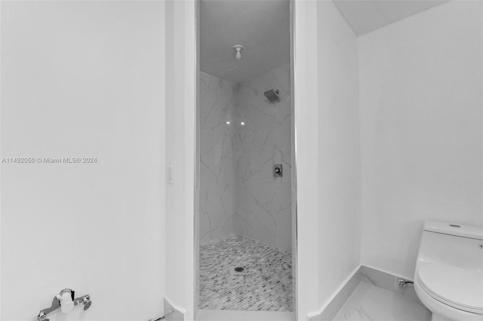 15951 Southwest 42nd Terrace Miami, FL 33185 - Photo 29 of 40 a bathroom with a shower