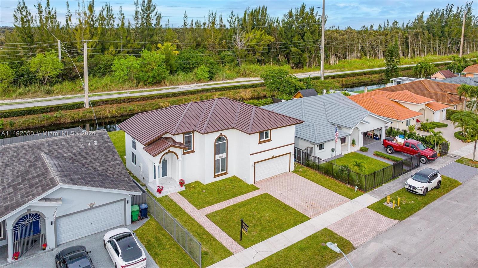 15951 Southwest 42nd Terrace Miami, FL 33185 - Photo 35 of 40 an aerial view of a house with garden space and street view