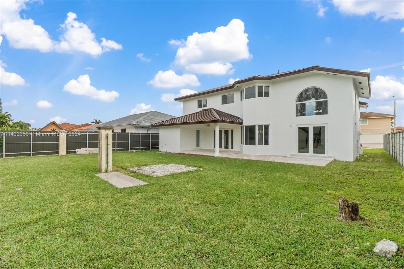 15951 Southwest 42nd Terrace Miami, FL 33185 - Photo 37 of 40 a view of a house with a backyard