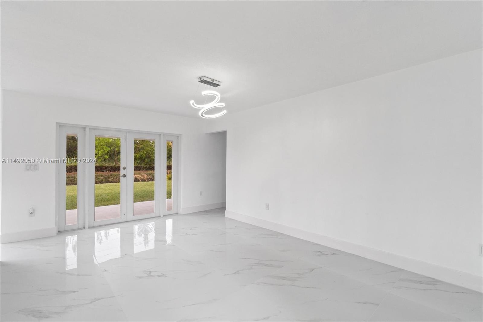 15951 Southwest 42nd Terrace Miami, FL 33185 - Photo 4 of 40 an empty room with windows