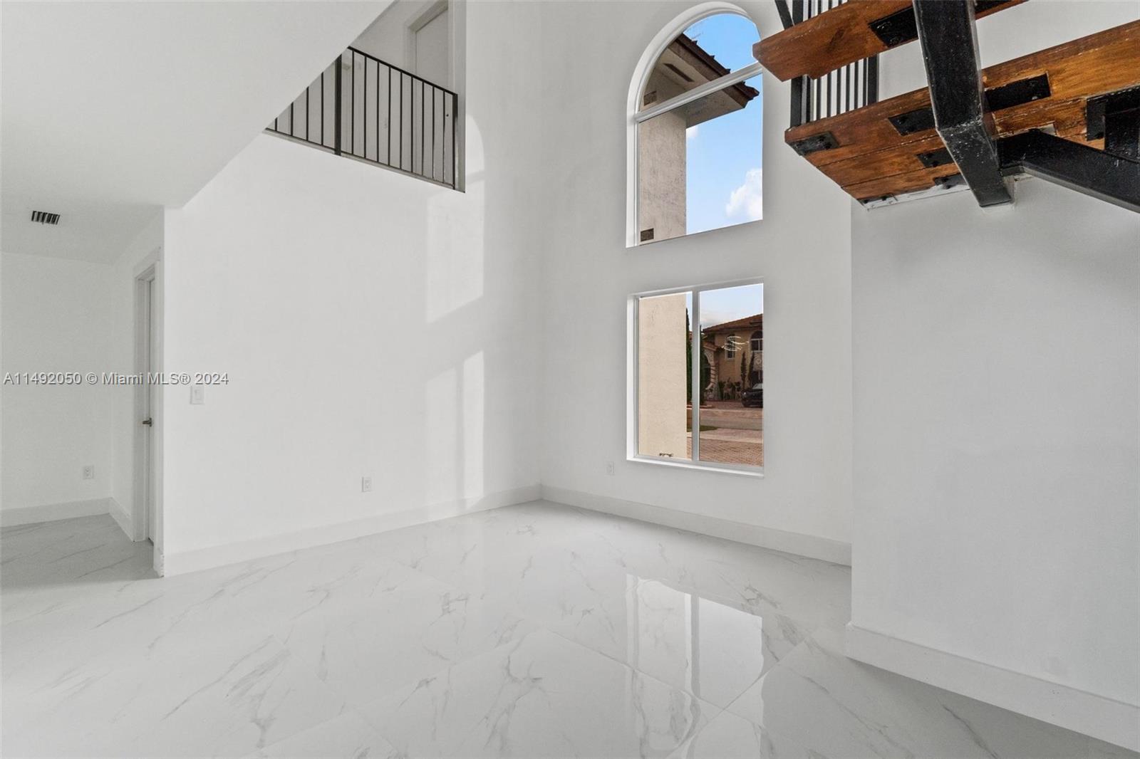 15951 Southwest 42nd Terrace Miami, FL 33185 - Photo 8 of 40 a view of an empty room with a window