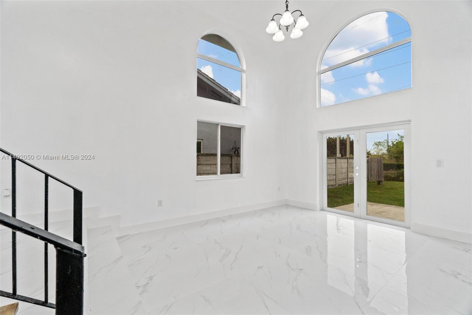 15951 Southwest 42nd Terrace Miami, FL 33185 - Photo 10 of 40 a view of an empty room with chandelier fan