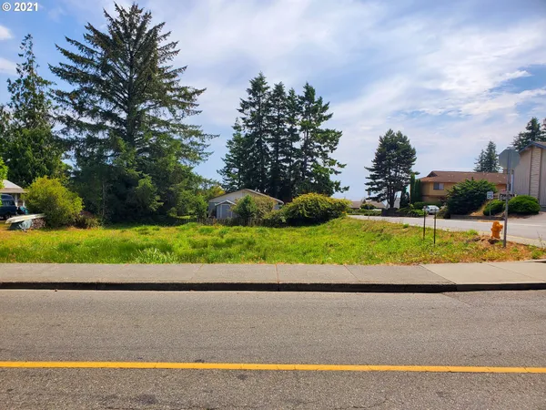 a view of a road with a yard