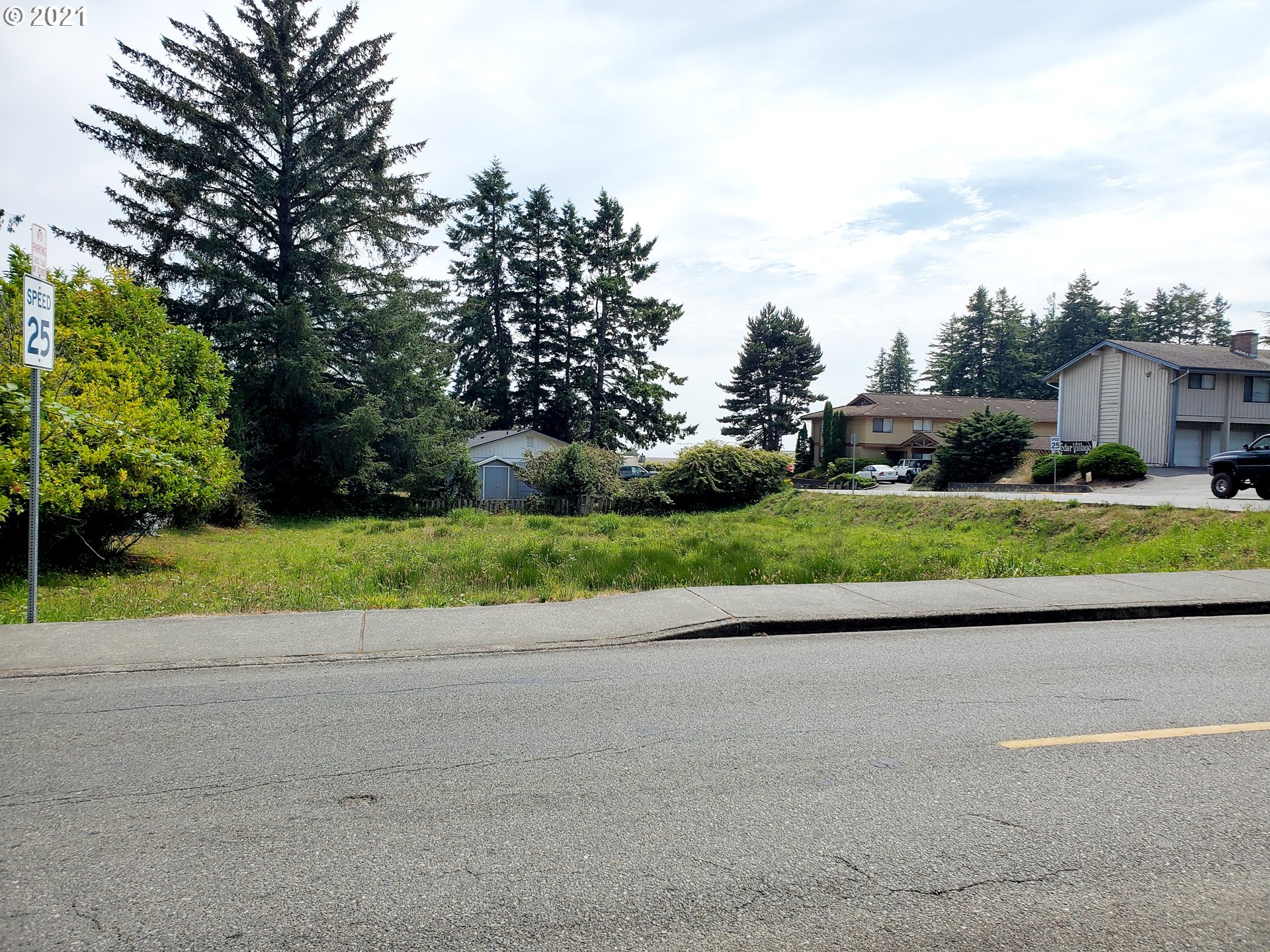 0 Easy Brookings, OR 97415 - Photo 2 of 10 a view of a road with a house in the background