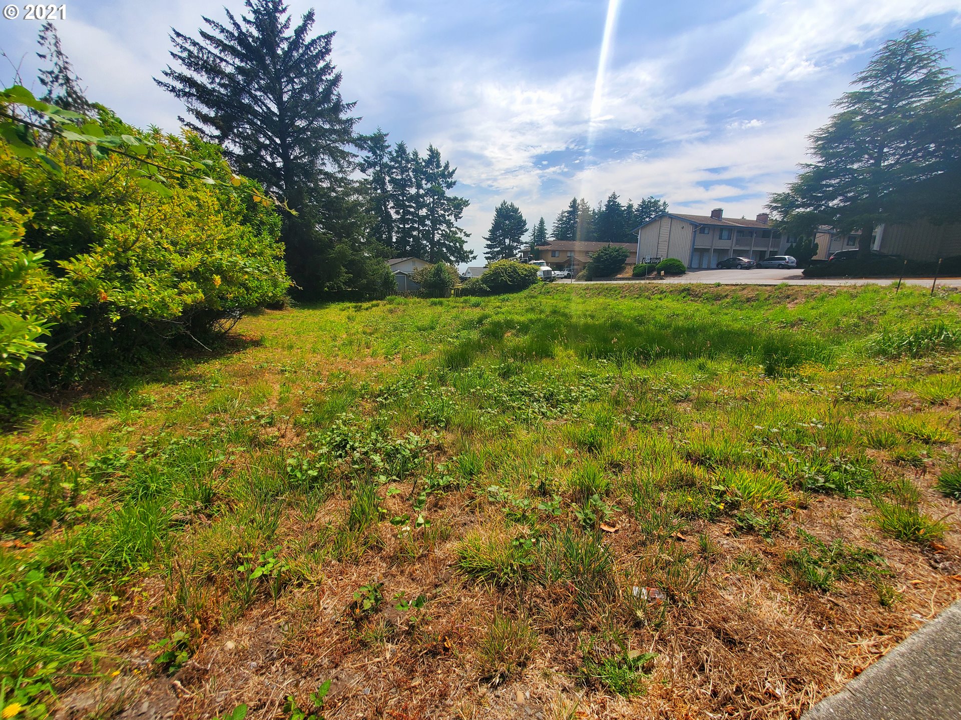 0 Easy Brookings, OR 97415 - Photo 9 of 10 a backyard of a house with lots of green space