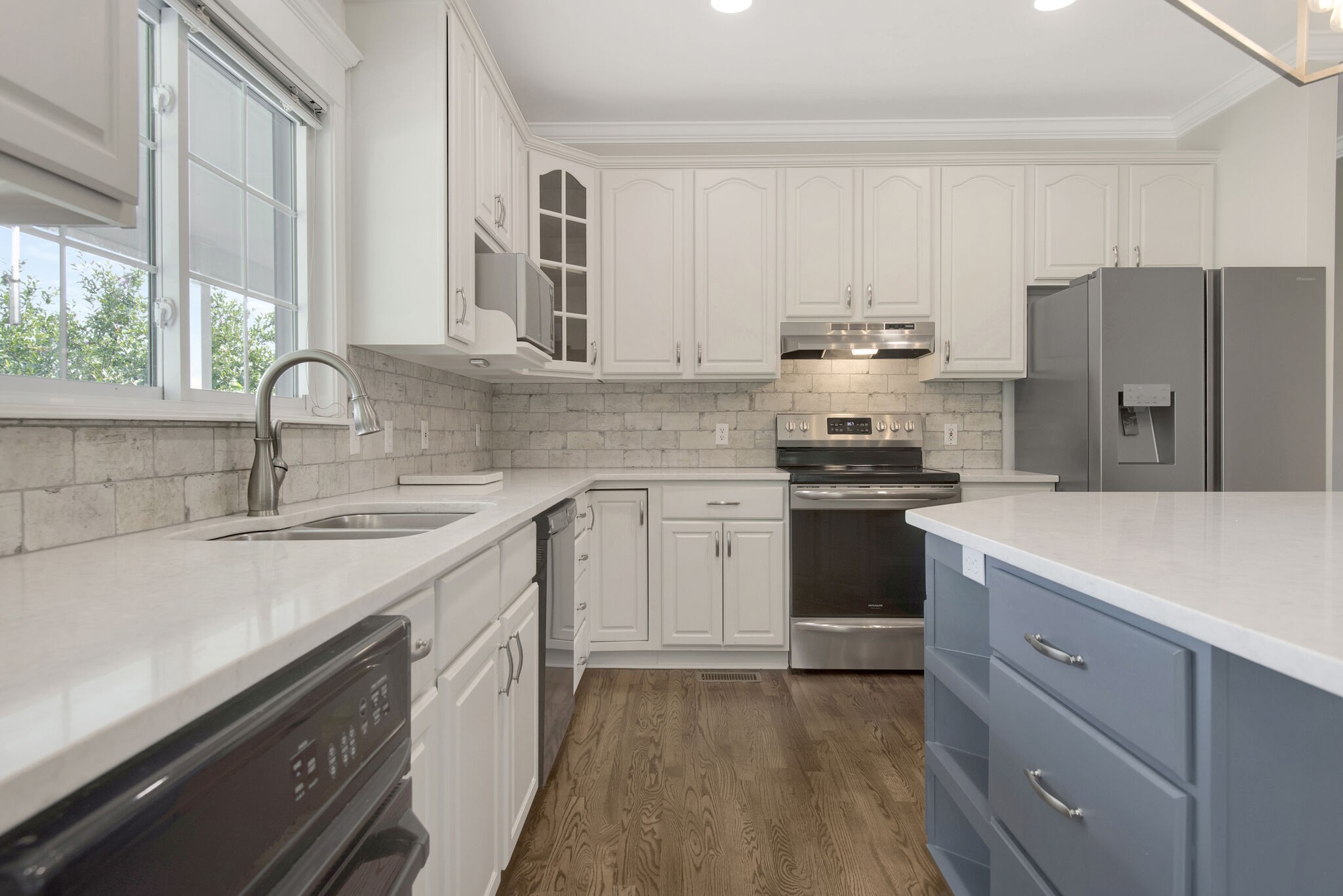 1576 Old Hillsboro Road Franklin, TN 37069 - Photo 17 of 66 a kitchen with a sink white cabinets and stainless steel appliances