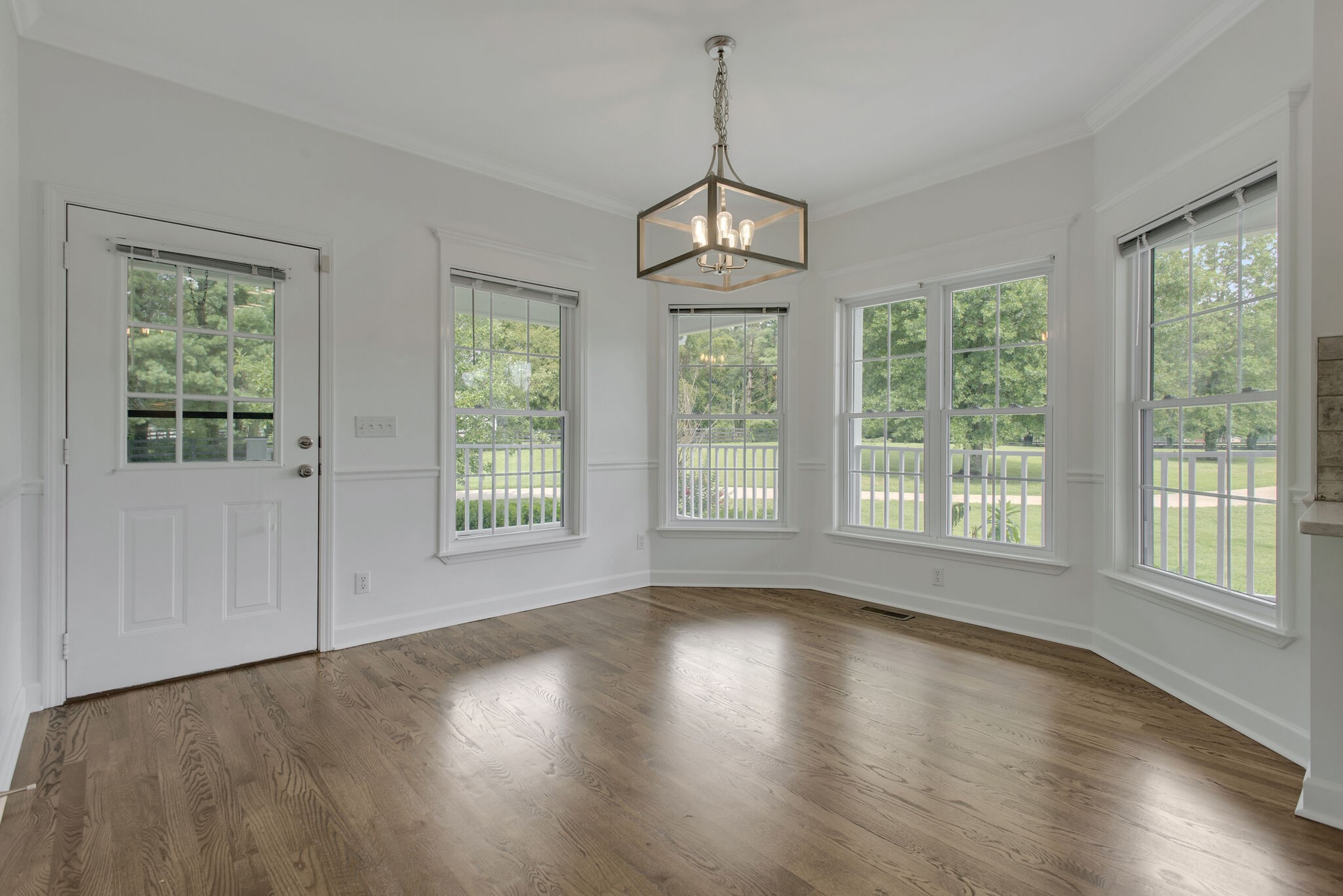 1576 Old Hillsboro Road Franklin, TN 37069 - Photo 20 of 66 a view of an empty room with wooden floor and a window