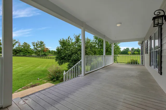 a view of a room with wooden floor and a window