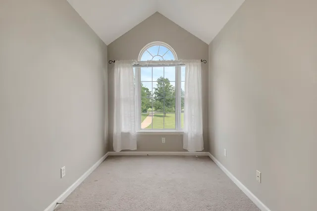 a kitchen with stainless steel appliances kitchen island granite countertop a stove and a sink