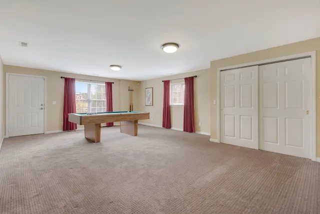 a view of a grassy field with trees