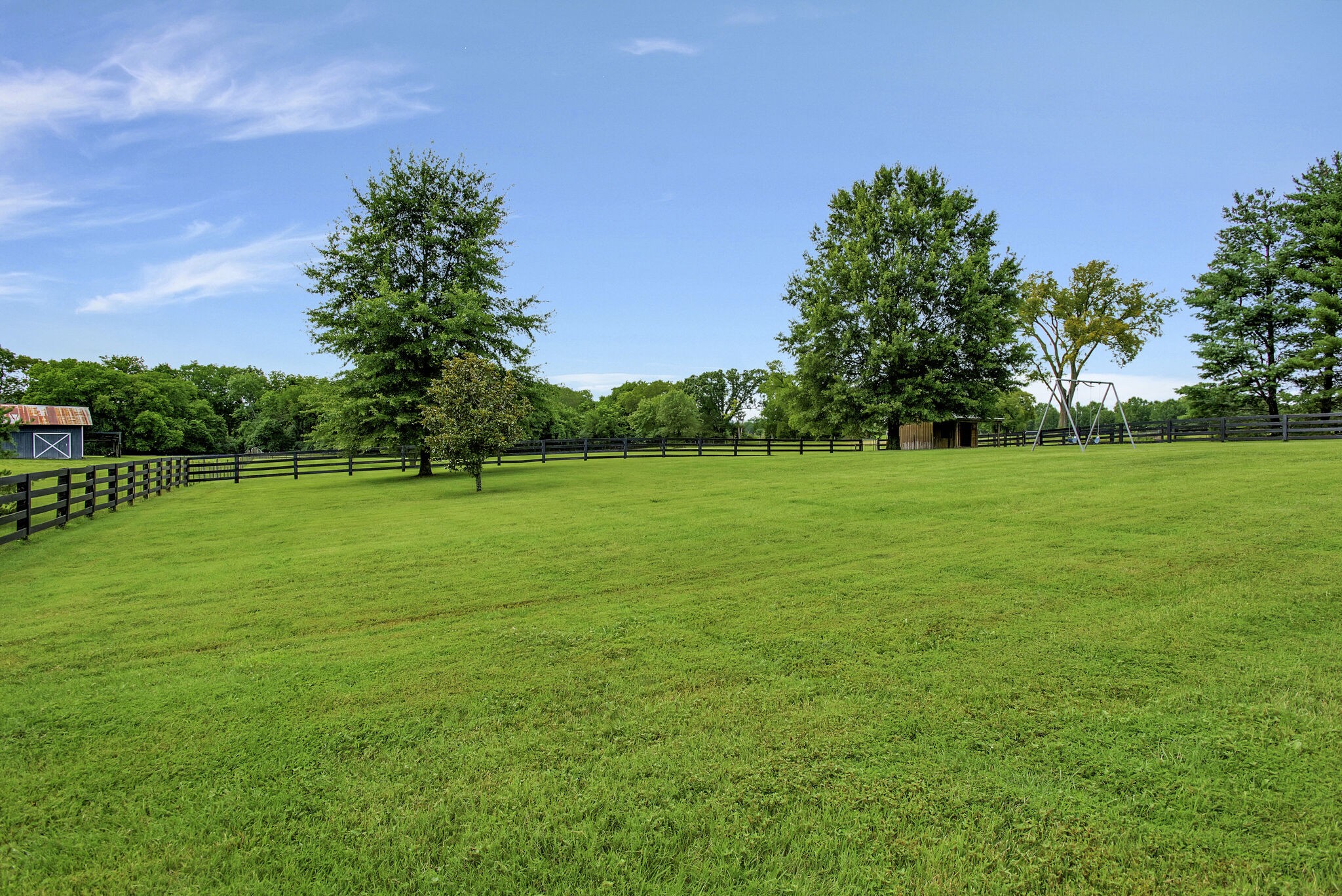 1576 Old Hillsboro Road Franklin, TN 37069 - Photo 63 of 66 a view of a grassy field with trees