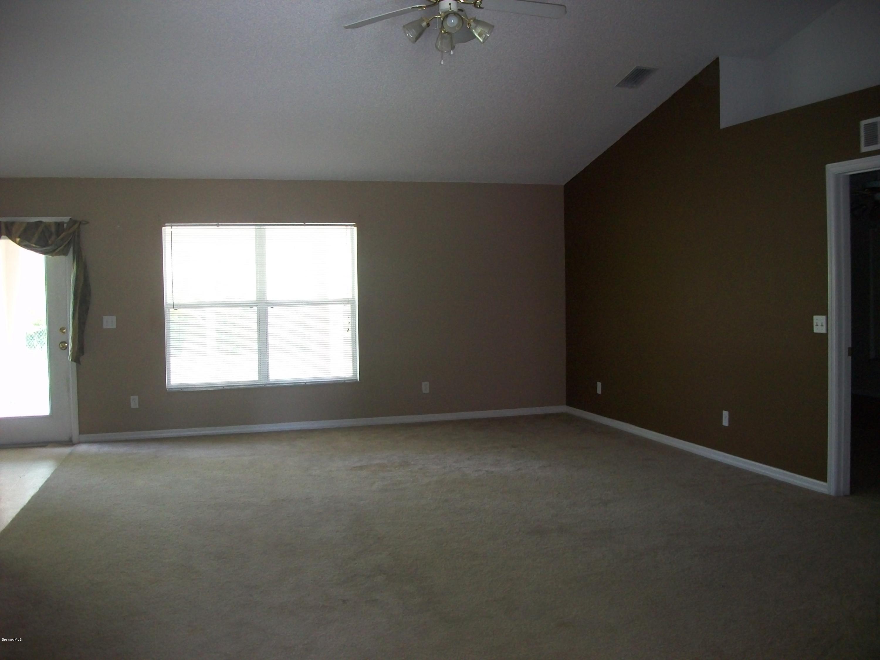 497 Australian Road Northwest Palm Bay, FL 32907 - Photo 2 of 14 Family Room