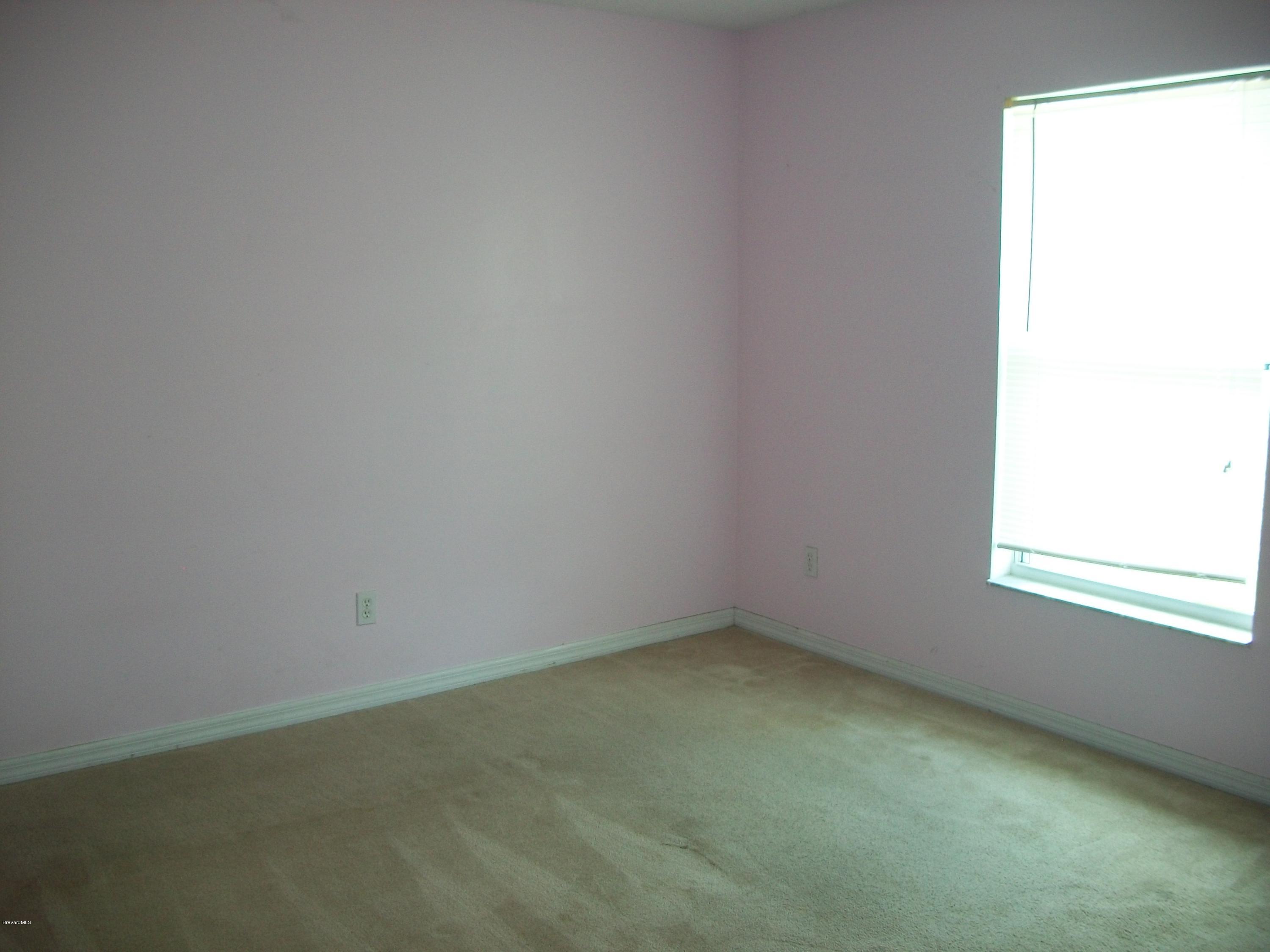 497 Australian Road Northwest Palm Bay, FL 32907 - Photo 11 of 14 Guest Bedroom #1