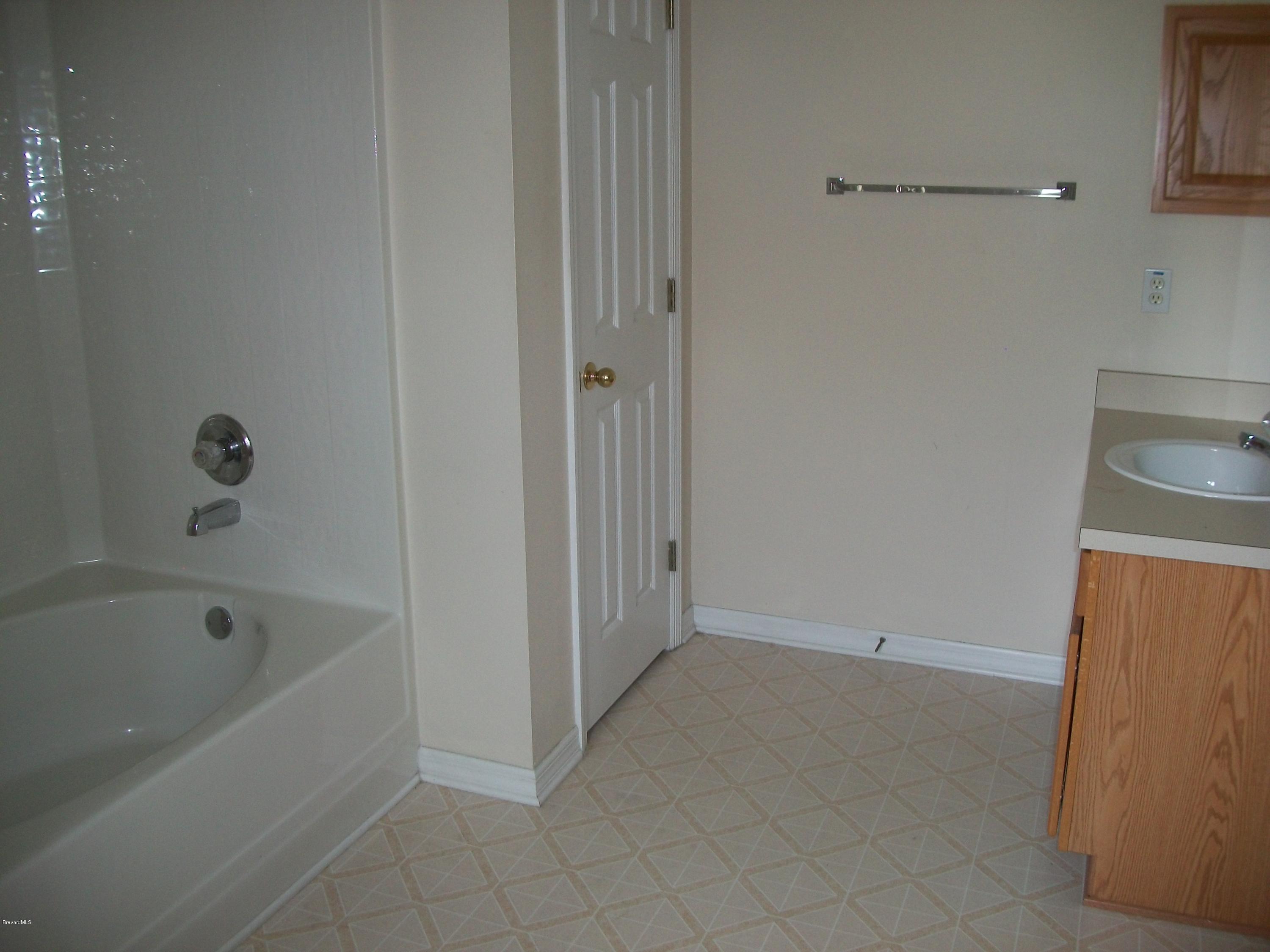 497 Australian Road Northwest Palm Bay, FL 32907 - Photo 9 of 14 Master Suite Bathroom