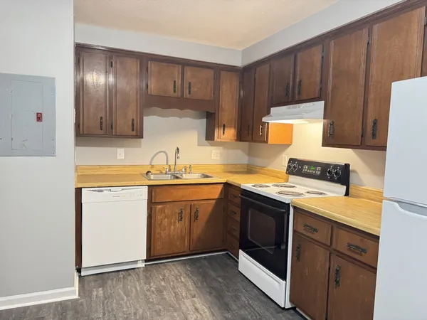 a kitchen with a sink cabinets and stainless steel appliances