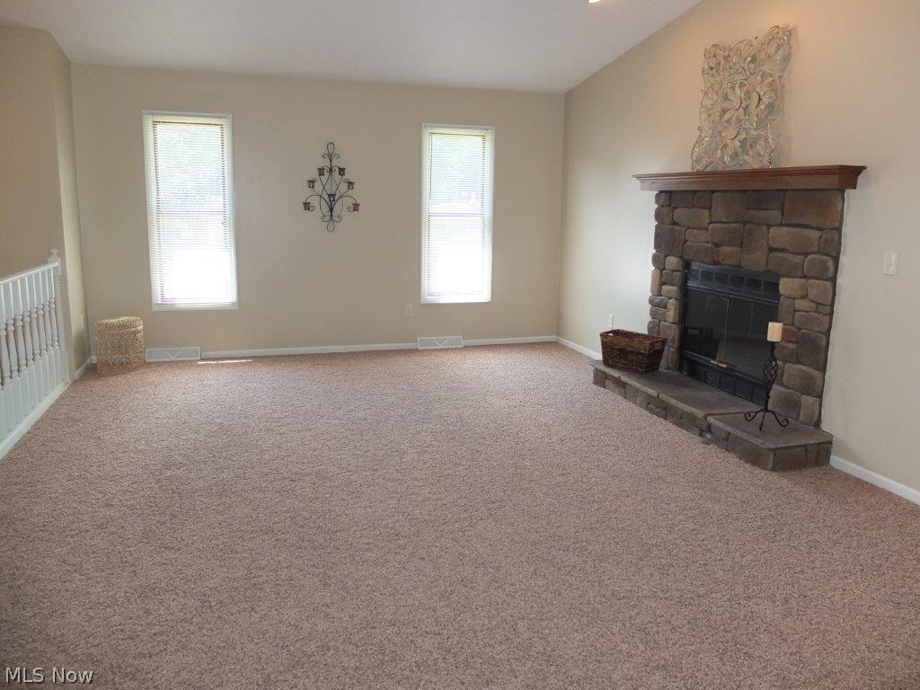 3713 Cottage Grove Road Akron, OH 44319 - Photo 2 of 18 Large great room with vaulted ceiling and gas fireplace.