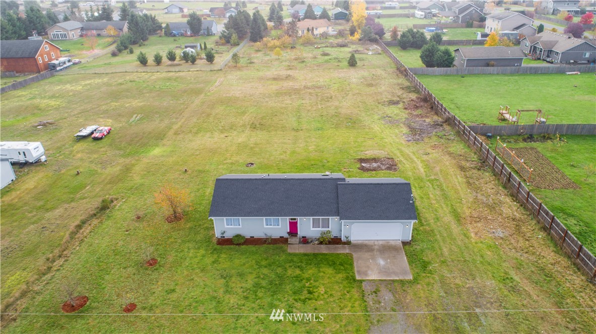 a aerial view of a house with a yard