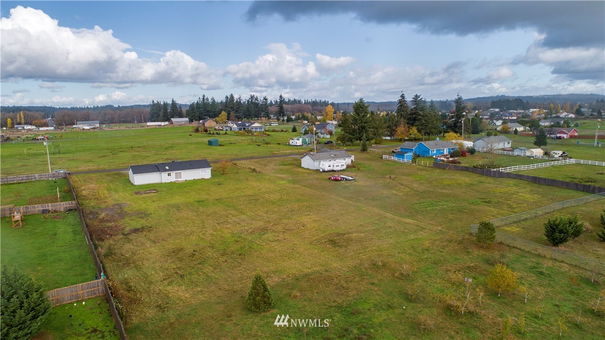 4425 180th Way Southwest Rochester, WA 98579 - Photo 17 of 25 a view of a lake with houses