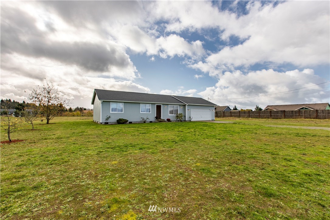 4425 180th Way Southwest Rochester, WA 98579 - Photo 3 of 25 a front view of house with yard