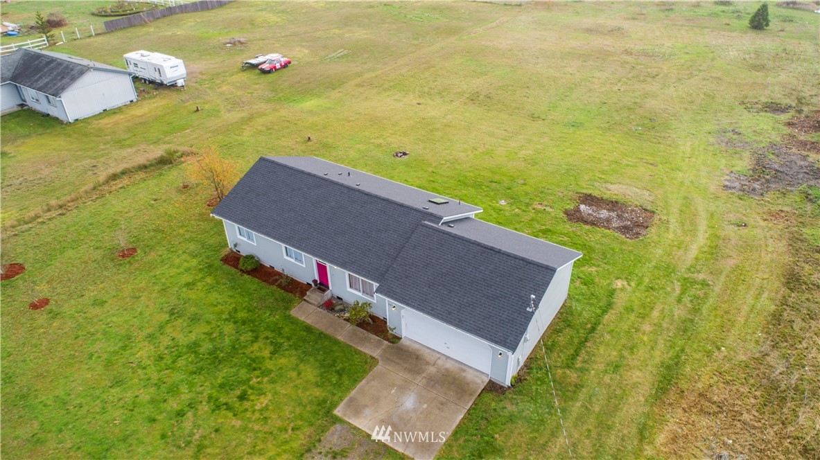 4425 180th Way Southwest Rochester, WA 98579 - Photo 4 of 25 a view of a big yard with an outdoor seating