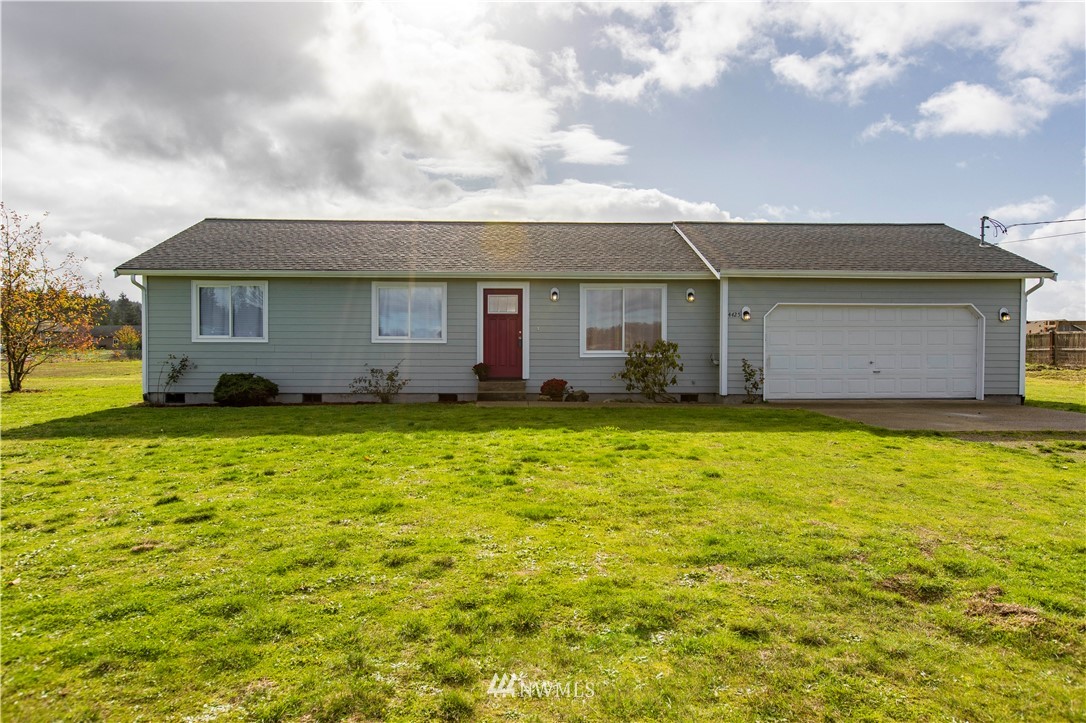 4425 180th Way Southwest Rochester, WA 98579 - Photo 5 of 25 a front view of house with yard and trees