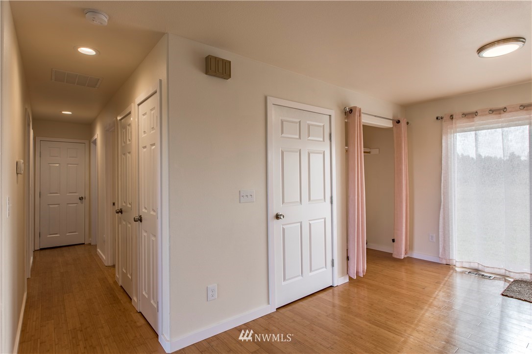 4425 180th Way Southwest Rochester, WA 98579 - Photo 8 of 25 a view of a livingroom with a hallway