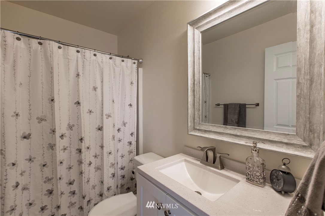 4425 180th Way Southwest Rochester, WA 98579 - Photo 10 of 25 a bathroom with a sink toilet and shower