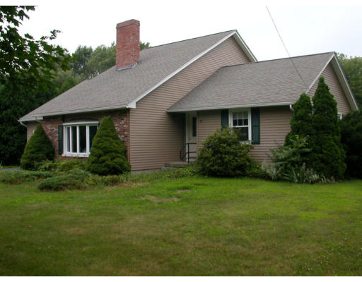 62 Plumtree Road Sunderland, MA 01375 - Photo 1 of 1 a front view of a house with a yard