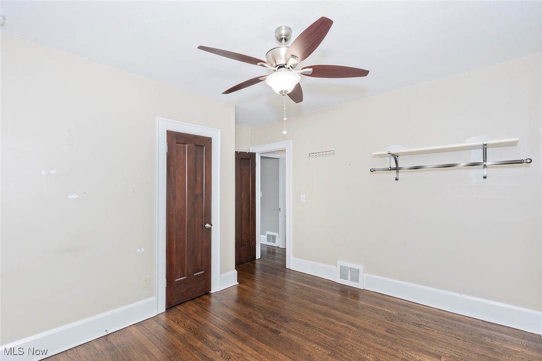2875 Coleridge Road Cleveland, OH 44118 - Photo 22 of 37 Spare room featuring dark wood-style flooring and ceiling fan