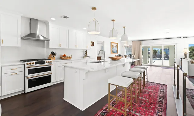 a bathroom with double sink and a mirror