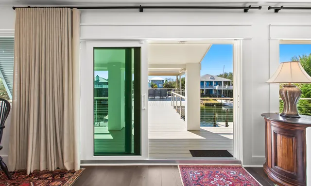 a view of a balcony with two chairs and a table