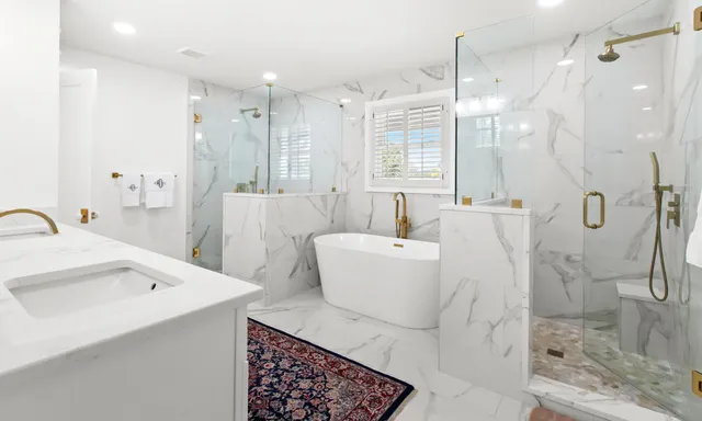 a view of a swimming pool with lounge chairs in patio