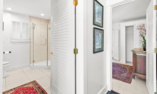 a patio with a table and chairs under an umbrella