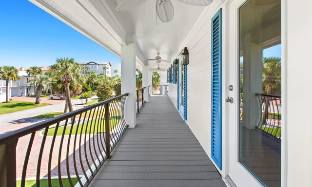 a balcony with an outdoor seating space
