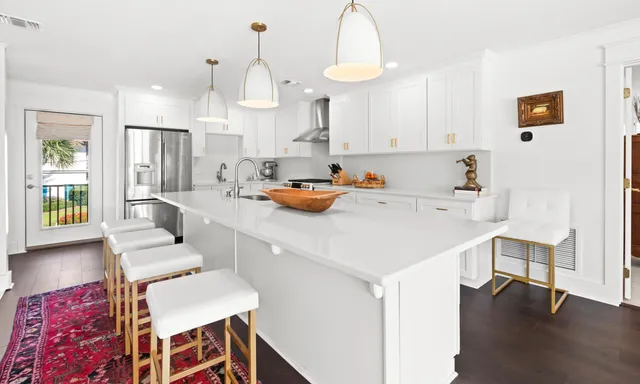 a living room with furniture and a baby crib