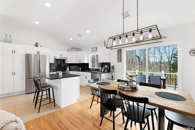 a view of a dining room with furniture window and outside view