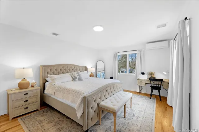 a bedroom with a bed and a table