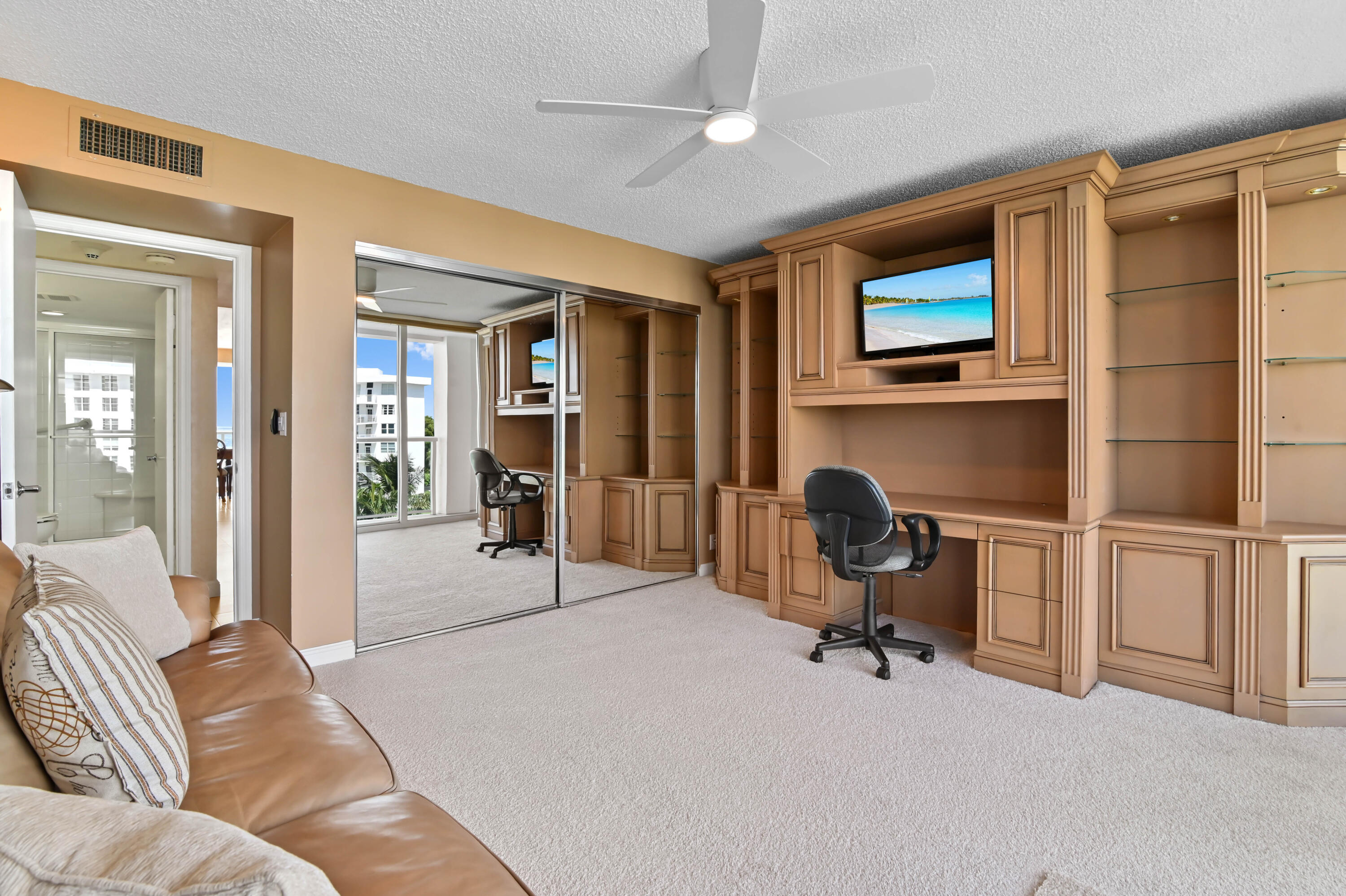 2800 South Ocean Boulevard, Unit 5J Boca Raton, FL 33432 - Photo 22 of 56 a view of a livingroom with workspace and a couch