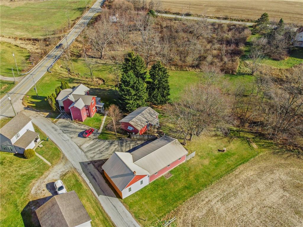 354 Storey Frye Road Ruffs Dale, PA 15679 - Photo 2 of 22 a view of a lake with couches in front of house