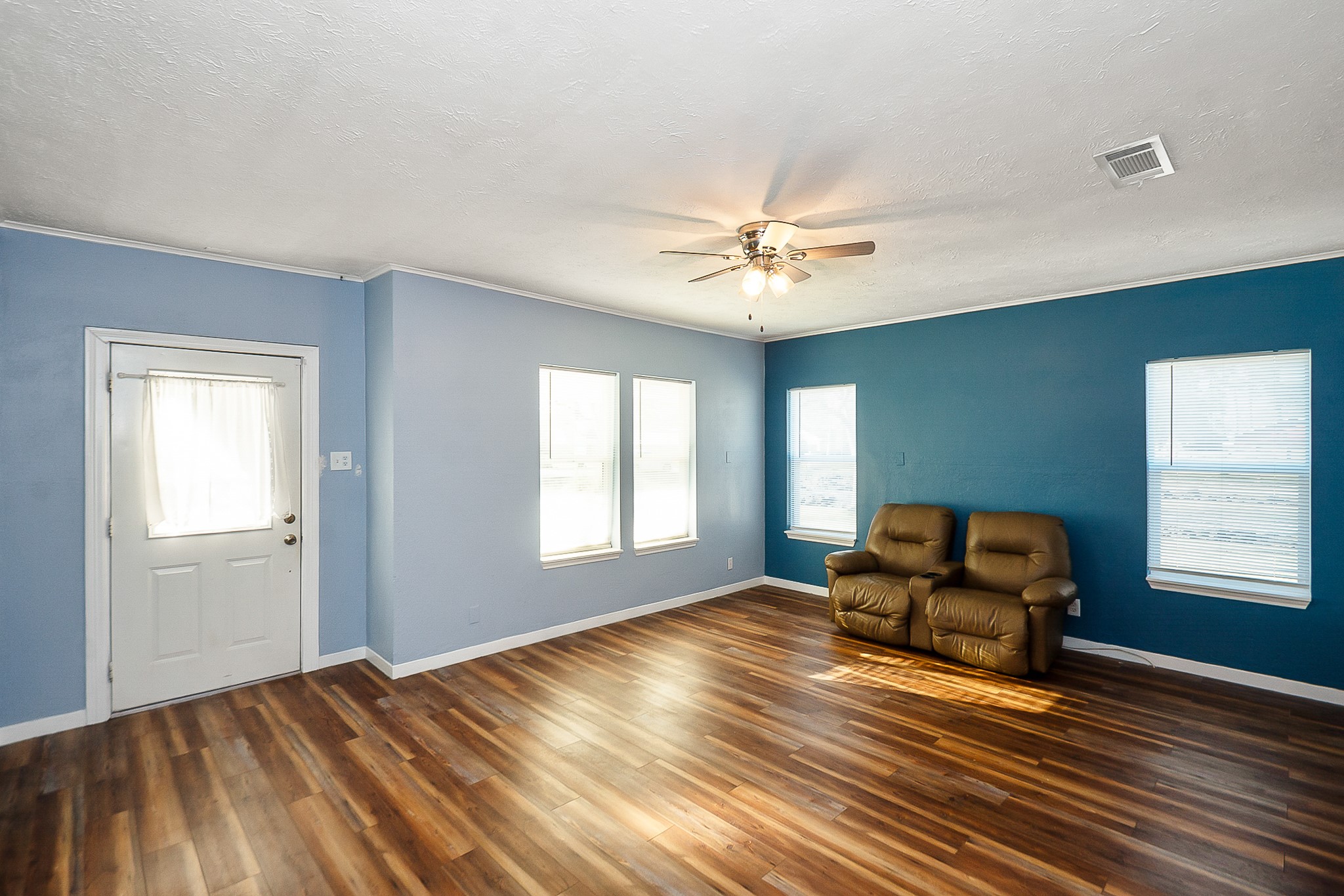 109 Maple Street Highlands, TX 77562 - Photo 11 of 50 a view of room with window chandelier fan and windows