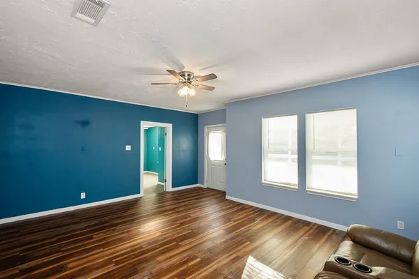 a view of an empty room with a window