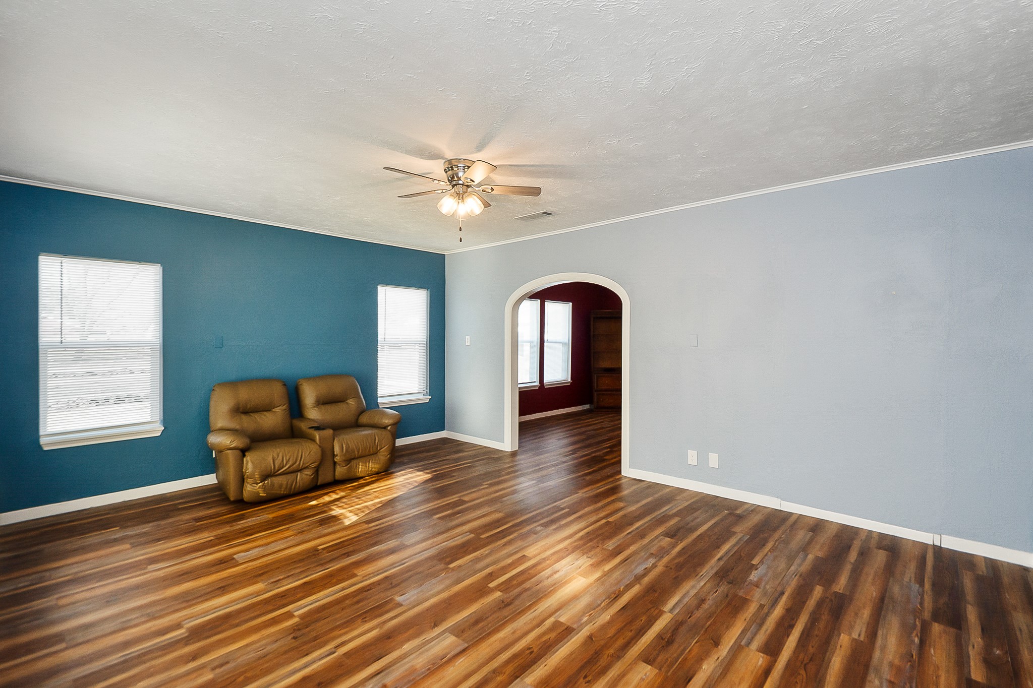109 Maple Street Highlands, TX 77562 - Photo 14 of 50 a view of a livingroom with furniture and wooden floor
